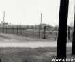 9242.Ulica Starogostynska w Gostyniu, z prawej strony widoczne boisko pilkarskie na miejscu ktorego w 1958 roku rozpoczeto rozbudowe huty szkla